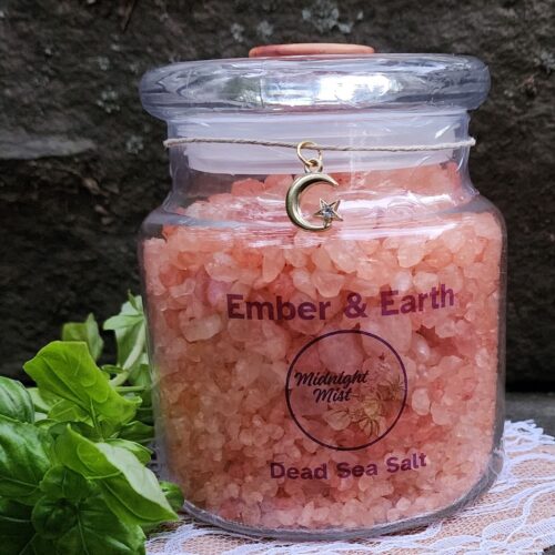 Close up of Ember & Earth patchouli dead sea salt jar with moon charm