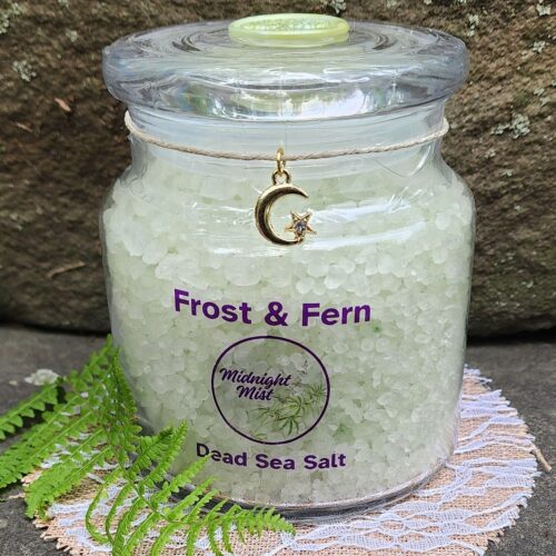 Close up of Frost & Fern mint dead sea salt jar with moon charm and green wax seal on lid