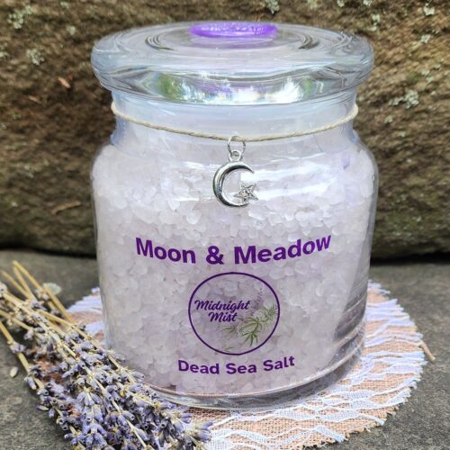 Close up of Moon & Meadow lavender dead sea salt jar with moon charm and purple wax seal on lid