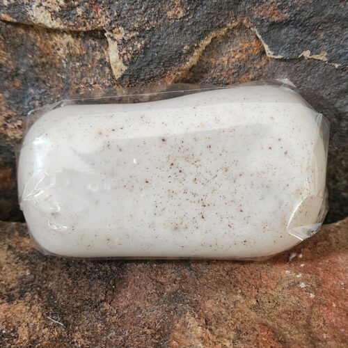 Close up of bar of beige Coffee & Oats soap