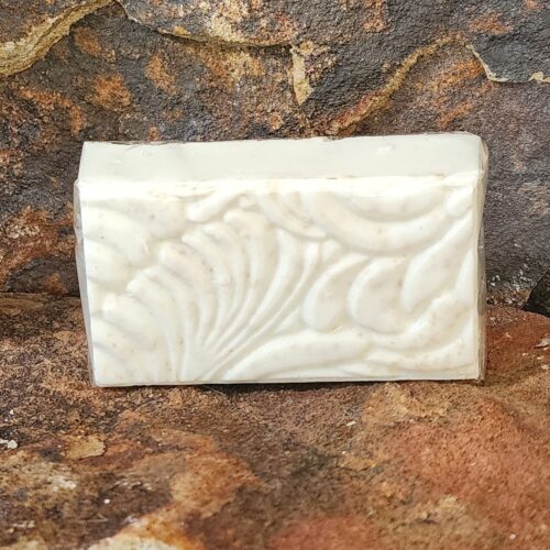 Close up of bar of white unscented Silk & Stone soap